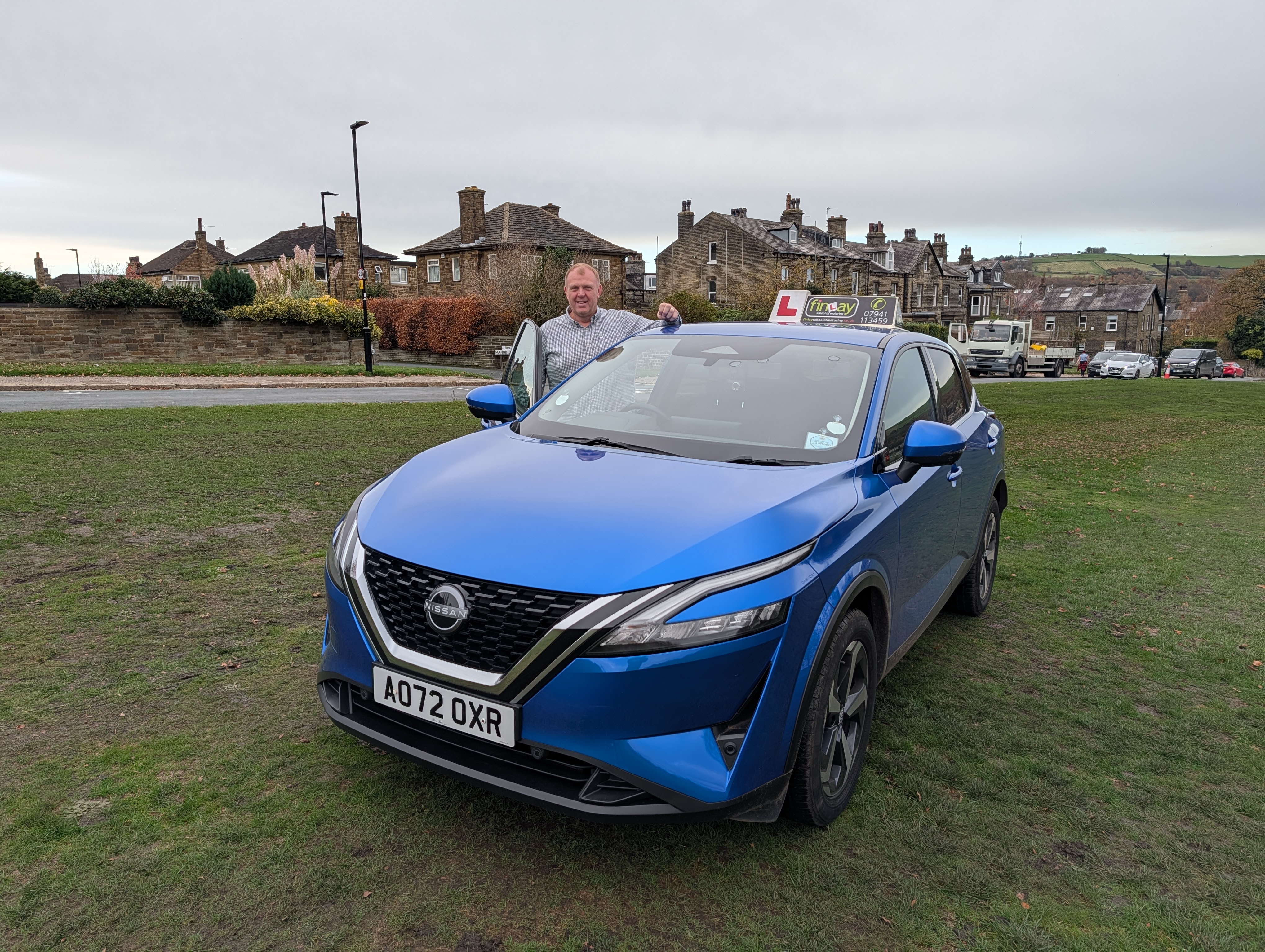 Professional driving instructor teaching student